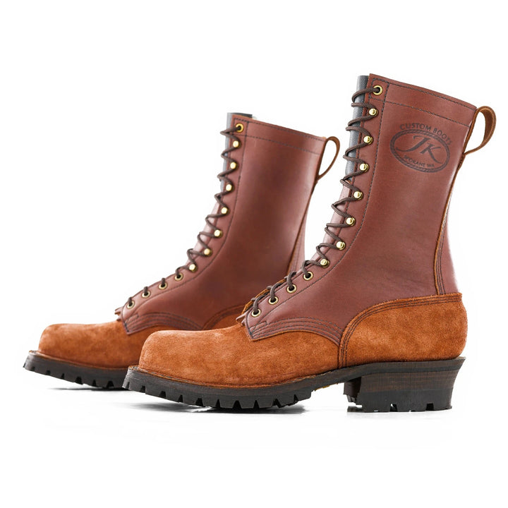 Side view of a pair of redwood leather work boots on a white background