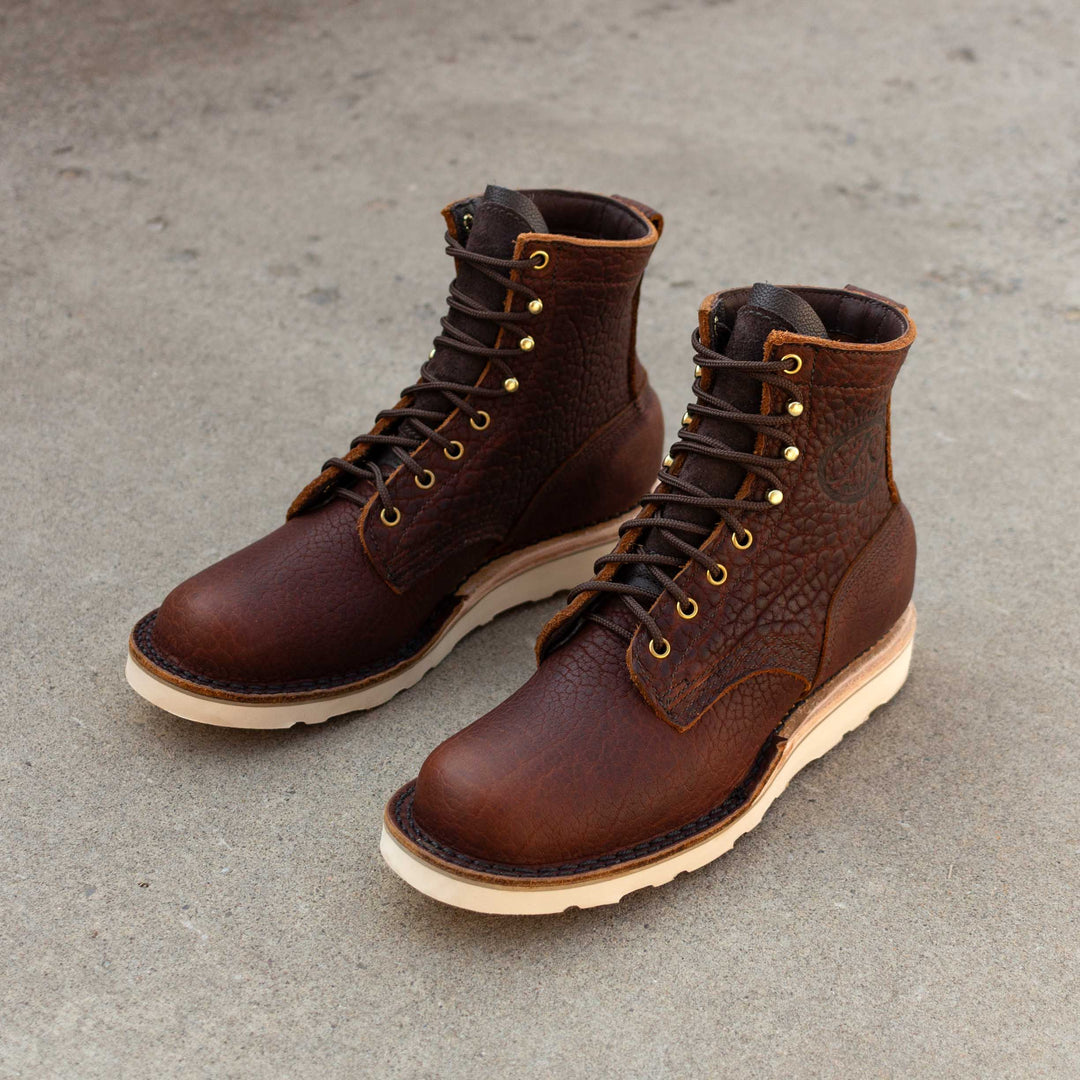 Pair of Forefront Bison leather work boots on concrete