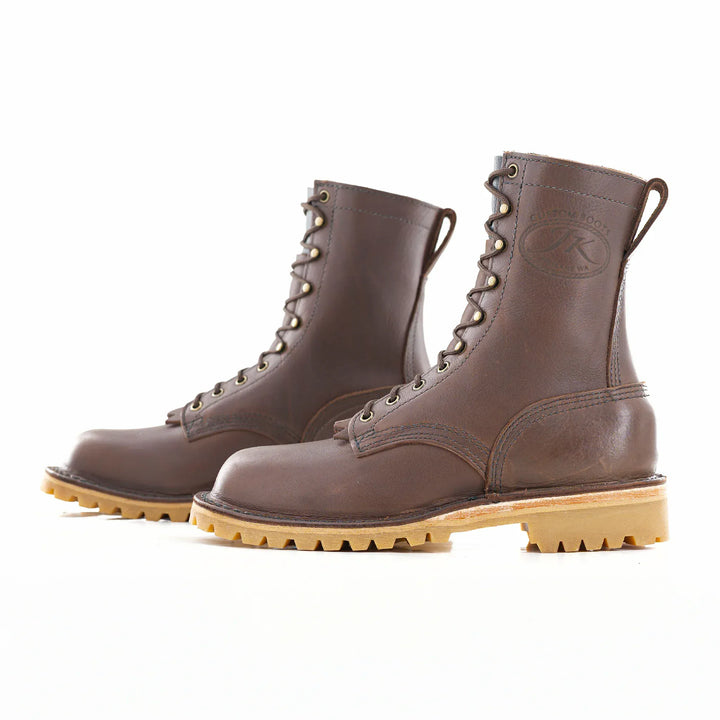 Side view of a pair of OT Brown leather work boots on a white background